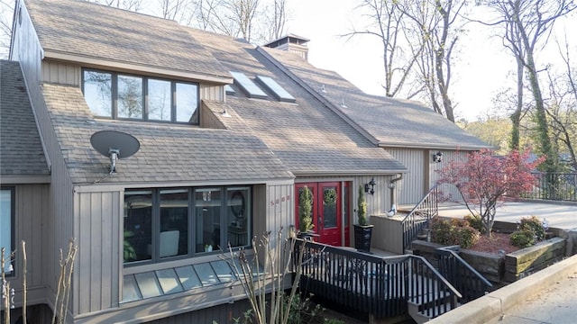 5008 Cliff Dr, Fort Smith, AR 72903 - view of front of property featuring a chimney, a deck, and roof with shingles
