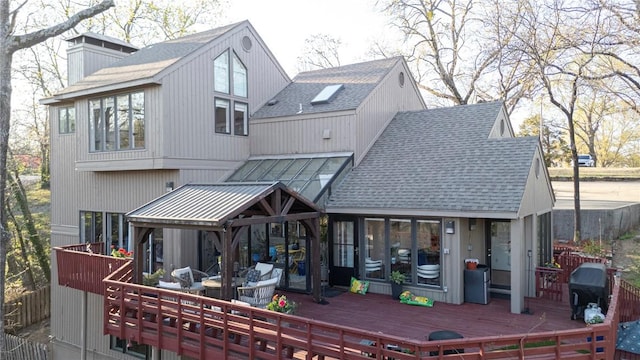 5008 Cliff Dr, Fort Smith, AR 72903 - back of property featuring a shingled roof, a chimney, and a wooden deck