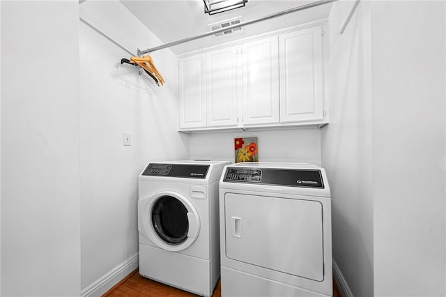 5008 Cliff Dr, Fort Smith, AR 72903 - laundry room featuring cabinet space, washing machine and clothes dryer, and baseboards