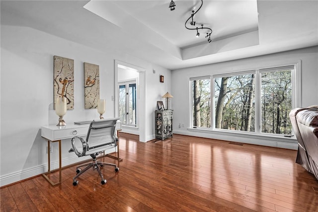 5008 Cliff Dr, Fort Smith, AR 72903 - home office featuring a raised ceiling, hardwood / wood-style flooring, baseboards, and rail lighting
