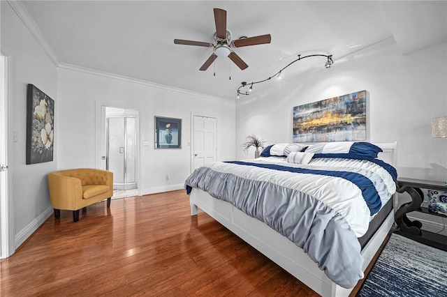 5008 Cliff Dr, Fort Smith, AR 72903 - bedroom with ornamental molding, wood finished floors, baseboards, rail lighting, and ceiling fan