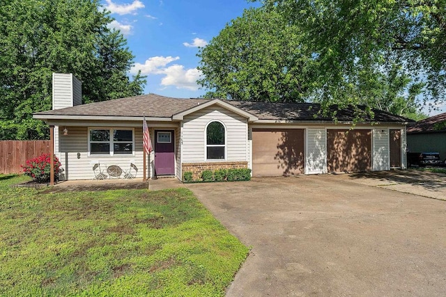 1165 Massey St, Decatur, AR 72722 - ranch-style home with a chimney, fence, a garage, concrete driveway, and a front yard