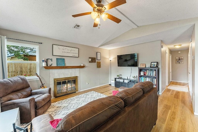 1165 Massey St, Decatur, AR 72722 - living area featuring a textured ceiling, visible vents, ceiling fan, and light wood-style floors