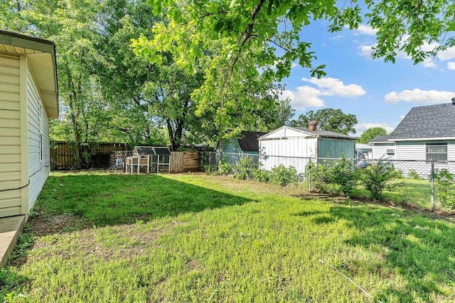 1165 Massey St, Decatur, AR 72722 - view of yard with an outdoor structure and a fenced backyard