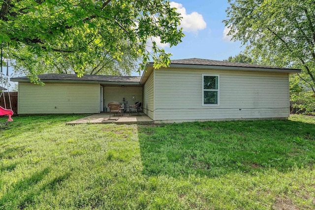 1165 Massey St, Decatur, AR 72722 - back of property featuring a lawn, a patio area, and fence