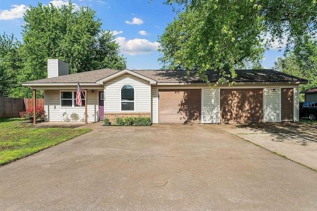 1165 Massey St, Decatur, AR 72722 - single story home featuring fence, an attached garage, concrete driveway, a front yard, and a chimney