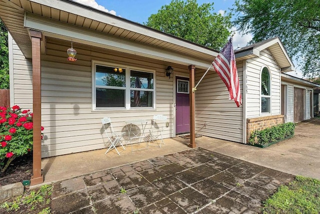 1165 Massey St, Decatur, AR 72722 - property entrance with a porch and brick siding