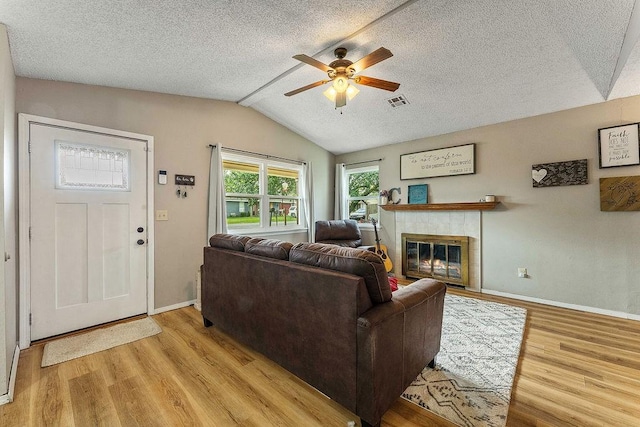 1165 Massey St, Decatur, AR 72722 - living area with baseboards, light wood finished floors, a ceiling fan, and vaulted ceiling