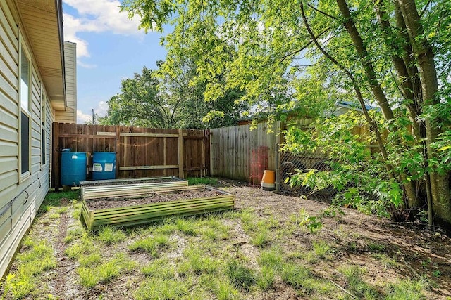 1165 Massey St, Decatur, AR 72722 - view of yard with a vegetable garden and a fenced backyard