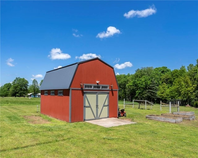 view of outbuilding with an outdoor structure and a garden