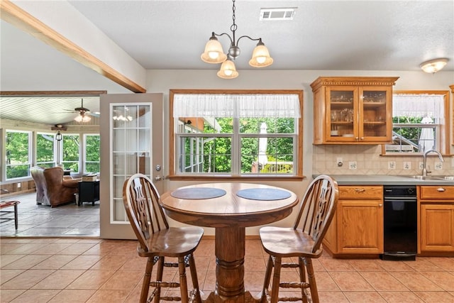 dining room featuring light tile patterned floors, visible vents, and ceiling fan with notable chandelier