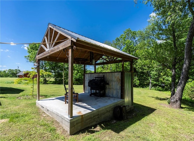 exterior space with a lawn and a gazebo