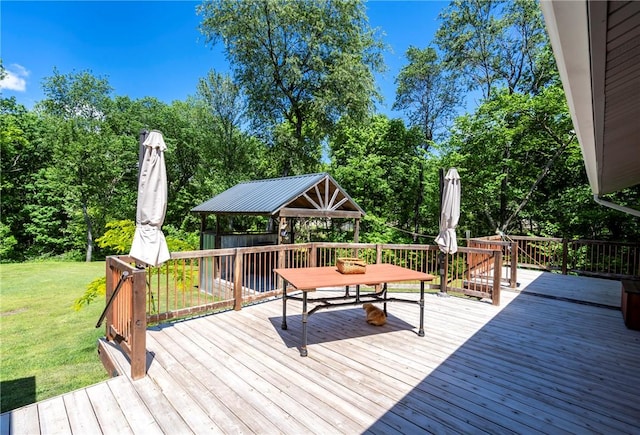 deck with a lawn, a gazebo, and outdoor dining area
