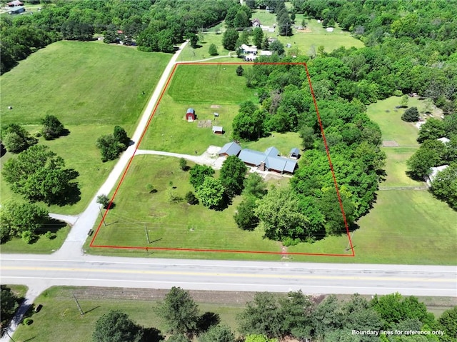 birds eye view of property with a rural view
