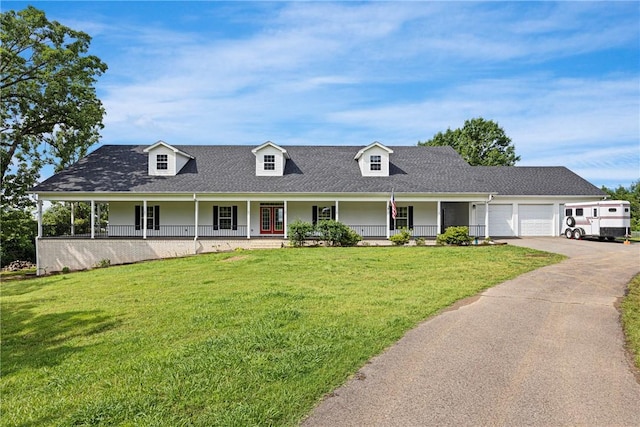 650 Painter Ln, Lamar, AR 72846 - view of front of home with covered porch, a garage, a front yard, and driveway