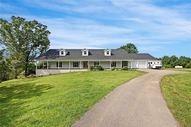 650 Painter Ln, Lamar, AR 72846 - view of front of property featuring covered porch, a garage, a front lawn, and asphalt driveway