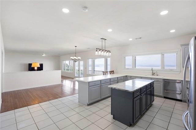 650 Painter Ln, Lamar, AR 72846 - kitchen featuring appliances with stainless steel finishes, a center island, a sink, recessed lighting, and light tile patterned floors