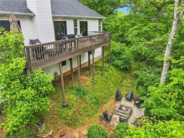 7 Croft Ledge Dr, Bentonville, AR 72712 - rear view of property featuring roof with shingles, a fire pit, and a wooden deck