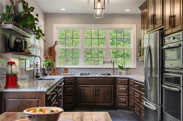 7 Croft Ledge Dr, Bentonville, AR 72712 - kitchen featuring appliances with stainless steel finishes, a sink, backsplash, healthy amount of natural light, and recessed lighting