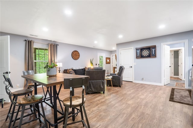 7 Croft Ledge Dr, Bentonville, AR 72712 - dining space featuring light wood-style flooring, recessed lighting, and baseboards