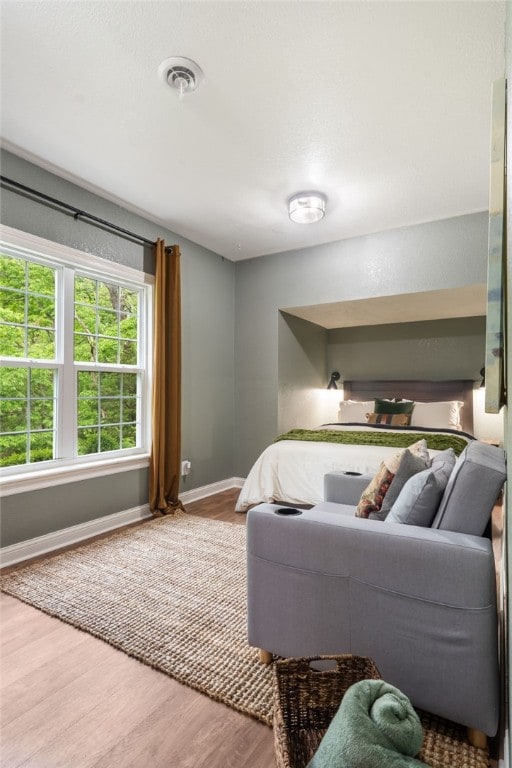 7 Croft Ledge Dr, Bentonville, AR 72712 - bedroom featuring baseboards and wood finished floors