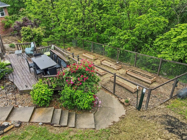 7 Croft Ledge Dr, Bentonville, AR 72712 - view of yard with a garden, a wooden deck, and outdoor dining space