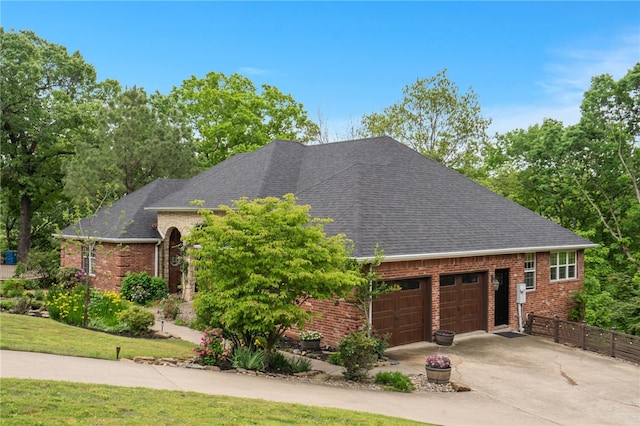 7 Croft Ledge Dr, Bentonville, AR 72712 - view of front of house featuring brick siding, an attached garage, driveway, and roof with shingles