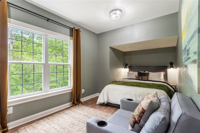 7 Croft Ledge Dr, Bentonville, AR 72712 - bedroom with wood finished floors and baseboards