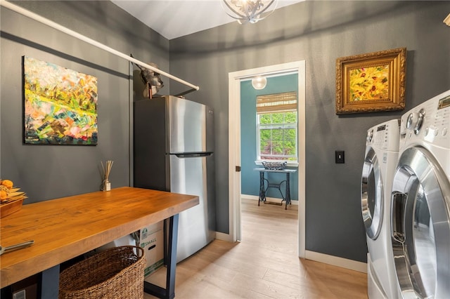 7 Croft Ledge Dr, Bentonville, AR 72712 - laundry area featuring light wood-style floors, washer and dryer, and baseboards