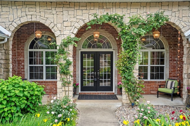 7 Croft Ledge Dr, Bentonville, AR 72712 - doorway to property featuring french doors, brick siding, and stone siding