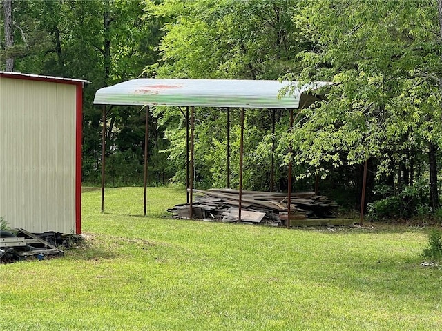 4401 Ar 74e, Jasper, AR 72641 - view of yard featuring a detached carport and a wooded view
