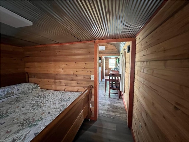 4401 Ar 74e, Jasper, AR 72641 - bedroom with wooden walls and dark wood-type flooring
