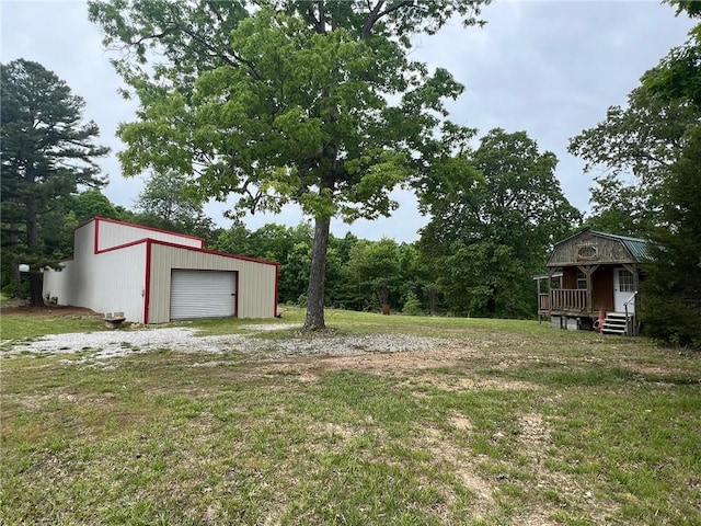 4401 Ar 74e, Jasper, AR 72641 - view of green lawn with an outbuilding and a detached garage