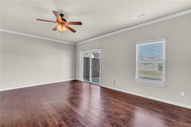 unfurnished room featuring baseboards, visible vents, wood finished floors, and a ceiling fan