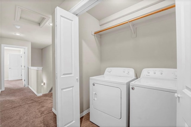 washroom featuring laundry area, attic access, carpet floors, baseboards, and independent washer and dryer