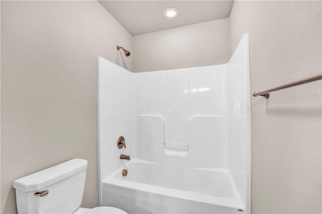 bathroom with toilet and shower / bath combination