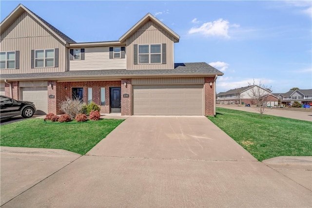 view of front of home featuring a garage, a front lawn, and brick siding