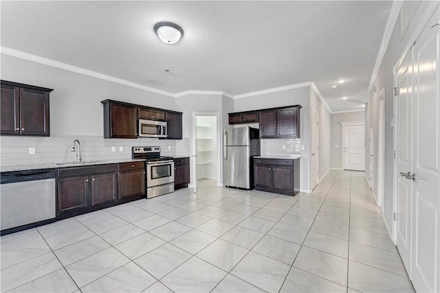 2769 W Kilimanjaro Way, Rogers, AR 72758 - kitchen with a sink, ornamental molding, decorative backsplash, dark brown cabinets, and appliances with stainless steel finishes