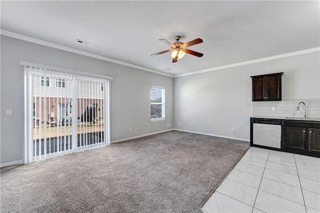 2769 W Kilimanjaro Way, Rogers, AR 72758 - unfurnished living room featuring ceiling fan, a sink, crown molding, light carpet, and baseboards