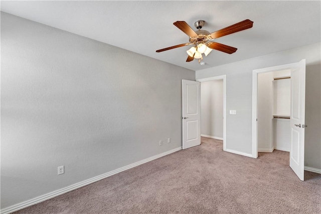 2769 W Kilimanjaro Way, Rogers, AR 72758 - unfurnished bedroom with carpet, baseboards, a ceiling fan, and a closet