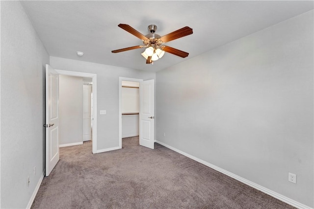 2769 W Kilimanjaro Way, Rogers, AR 72758 - unfurnished bedroom with baseboards, a closet, ceiling fan, and carpet