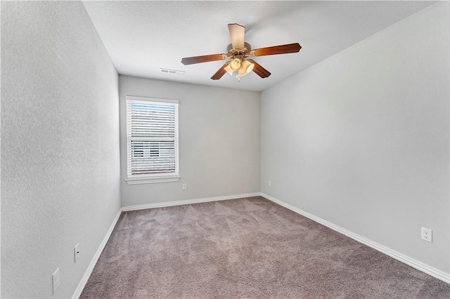2769 W Kilimanjaro Way, Rogers, AR 72758 - carpeted empty room with visible vents, baseboards, and ceiling fan