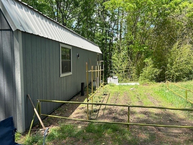 191 NC-6015, Jasper, AR 72641 - view of side of home with metal roof and fence