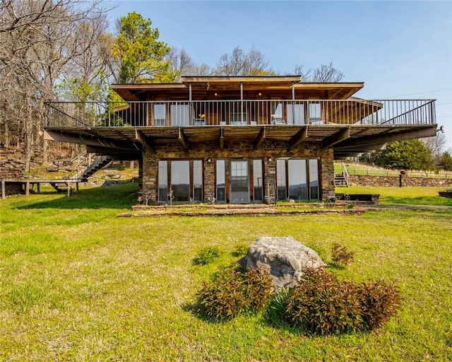 315 N Letitia Ave, Fayetteville, AR 72701 - back of house featuring a lawn, a deck, and stairway