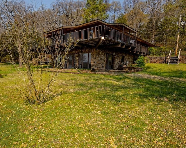 315 N Letitia Ave, Fayetteville, AR 72701 - rear view of property featuring a lawn, a deck, and stone siding