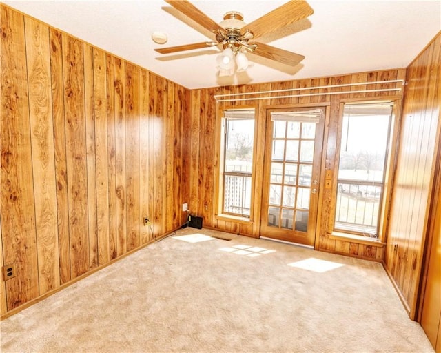 315 N Letitia Ave, Fayetteville, AR 72701 - carpeted empty room with wood walls and ceiling fan