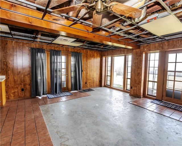 315 N Letitia Ave, Fayetteville, AR 72701 - miscellaneous room with wooden walls and concrete floors