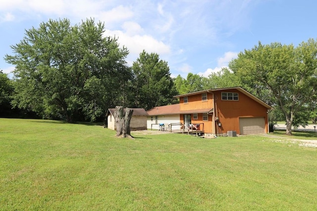 602 Centennial Ave, West Fork, AR 72774 - back of house featuring a storage shed, a garage, a lawn, an outbuilding, and driveway