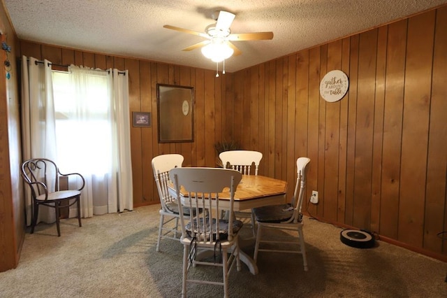 602 Centennial Ave, West Fork, AR 72774 - dining space with a ceiling fan, light carpet, wooden walls, and a textured ceiling