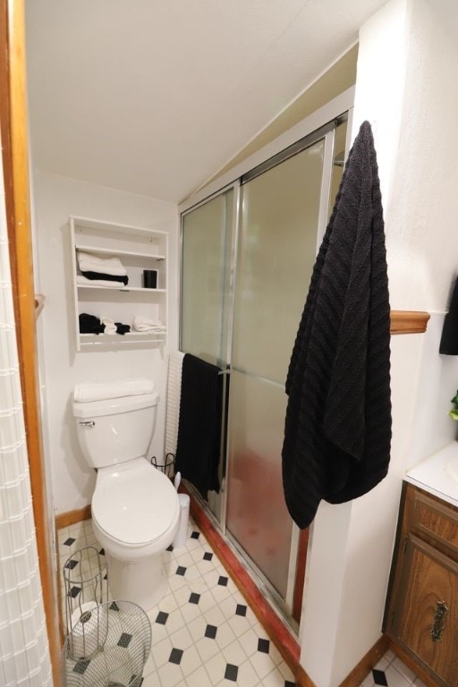 602 Centennial Ave, West Fork, AR 72774 - bathroom featuring a stall shower, tile patterned flooring, vanity, and toilet